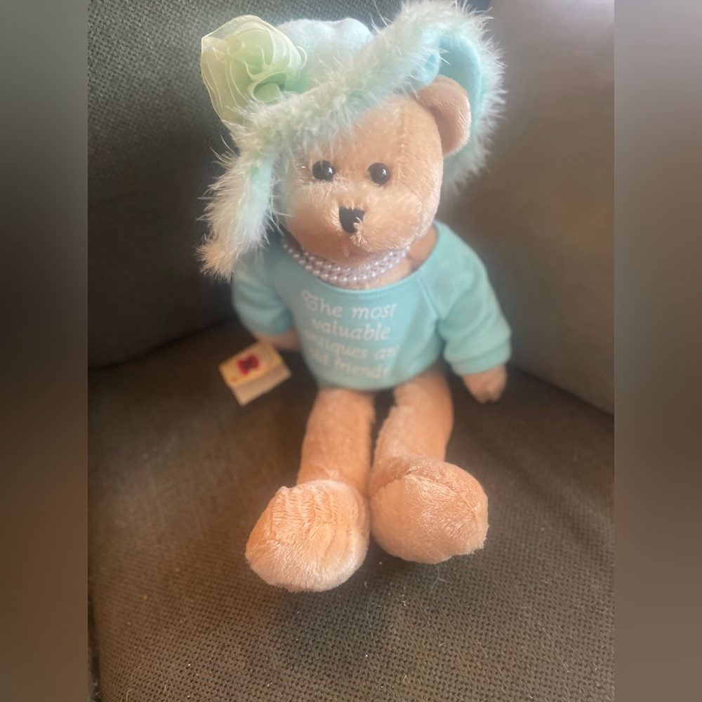 Chantilly Lane Musical’s Red Hat Bear . Sings That’s What Friends Are For .